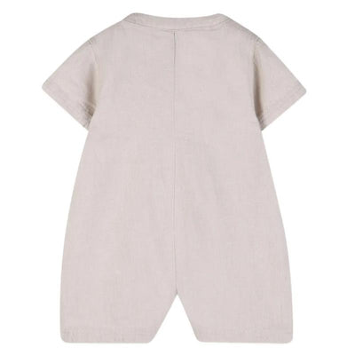 Short sleeve ivory linen romper for infants, featuring a simple design with back seam details.