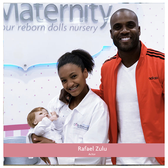 Rafael Zulu with his daughter adopting dolls at the MacroBaby Dolls Matenity