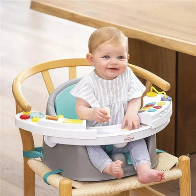 Infantino Music & Lights 3-In-1 Discovery Seat with a smiling baby seated and playing with colorful toys and snacks.