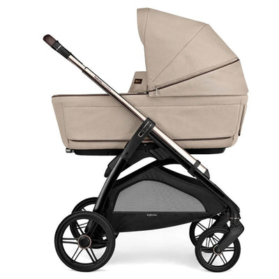 Inglesina Aptica Complete Stroller with Bassinet, featuring a sleek Pashmina Beige design and a sturdy black frame.