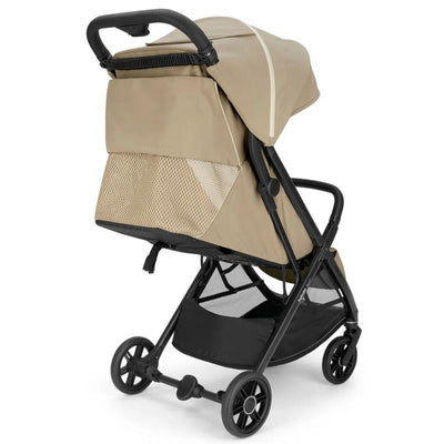 Compact Inglesina Quid³ stroller in lunar beige, featuring a foldable design, mesh storage, and sleek black wheels.
