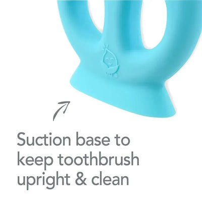 Silicone learning toothbrush in aqua with a suction base for upright storage and cleanliness, suitable for ages 9 to 18 months.