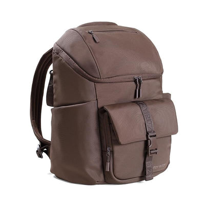 Mocha unisex Itzy Ritzy Belong Bucket Backpack™ with zippered compartments and a front buckle pocket.