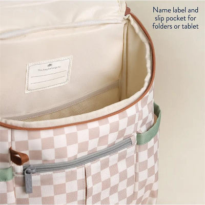 Interior view of Itzy Ritzy Itzy Explorer™ Big Kid Backpack, showing name label and slip pocket for folders or tablet.