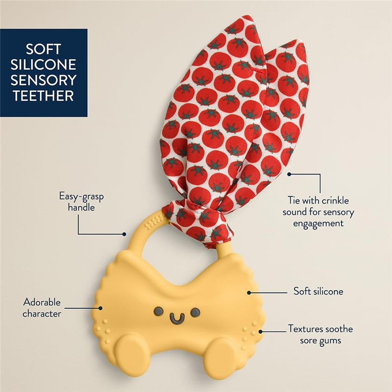 Soft silicone teether featuring an easy-grasp handle and a crinkle tie with tomato print for sensory engagement.