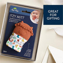 Silicone teething mitten designed as a cow, with colorful fabric featuring various patterns; suitable for infants 3 months and older.