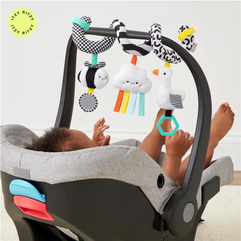 Spiral car seat and stroller activity toy by Itzy Ritzy, featuring soft plush toys including a bee, cloud, and bird, with colorful attachments.