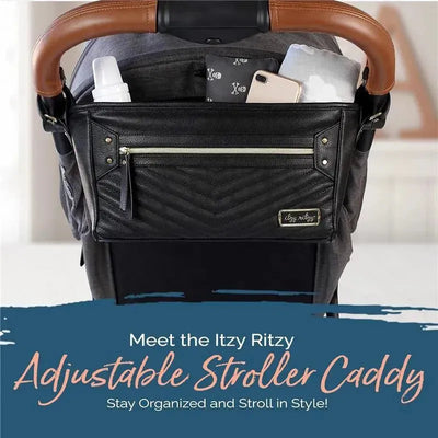 Adjustable Stroller Caddy by Itzy Ritzy, featuring pockets for bottles and a phone, attached to a stroller handle.