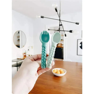 Mint Sweetie Spoons & Fork Set held in a hand, featuring a braided handle design and soft mint colors.