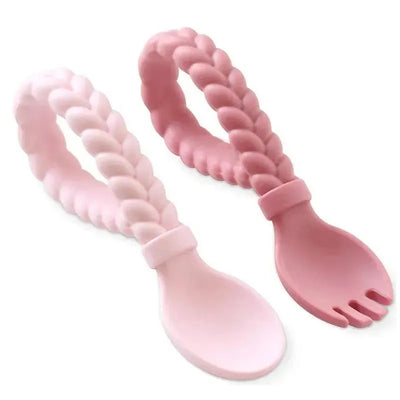 Silicone baby utensil set in pink, featuring a spoon and fork with braided handles for easy gripping.