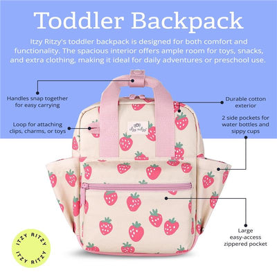 Toddler backpack by Itzy Ritzy in a pink strawberry design with durable cotton exterior, side pockets, and zippers.