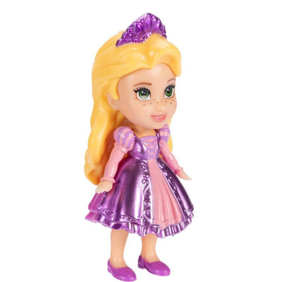A 3-inch Rapunzel figure from Jakks, wearing a purple dress and crown, with bright green eyes and long blonde hair.