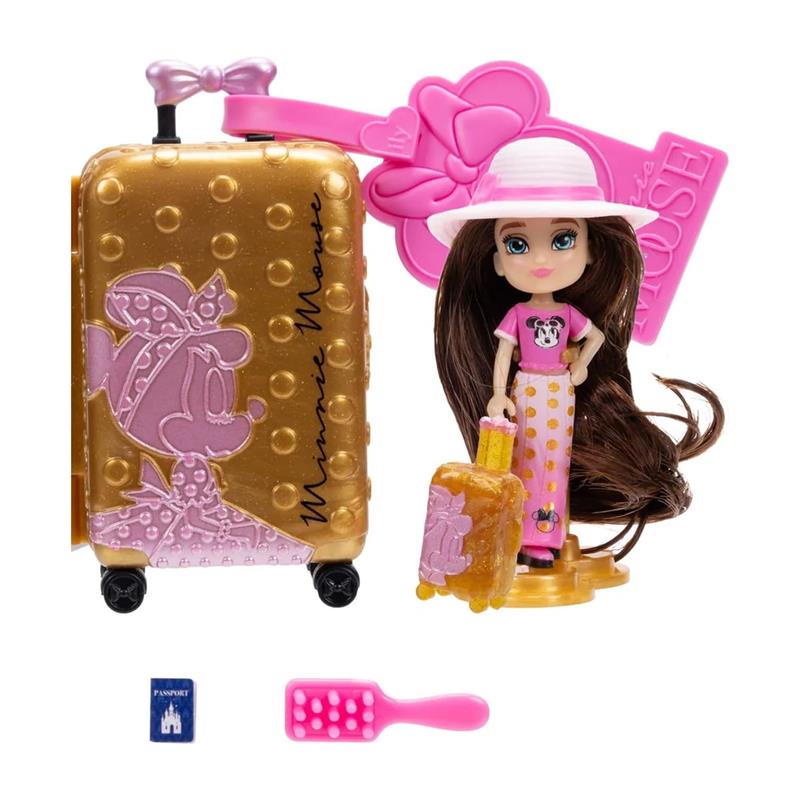 Minnie Mouse-inspired ILY 4ever doll with a golden suitcase, pink accessories, and a hairbrush, featuring travel-themed details.