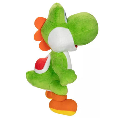 Green Yoshi plush toy with orange spikes, white belly, and red shell-like design on its back, standing upright.