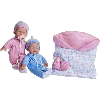 Soft body twin baby dolls in pink and blue outfits with pacifiers, alongside a reversible sleeping bag and accessories.