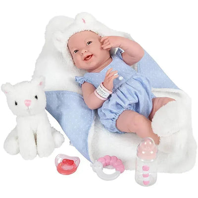 All-vinyl baby doll in a blue onesie with a white cat-themed blanket, accompanied by a plush cat, bottle, and accessories.
