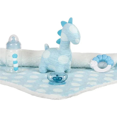 Blue polka dot blanket with a blue plush dinosaur, baby bottle, pacifier, and a baby teether toy in a light blue color scheme.