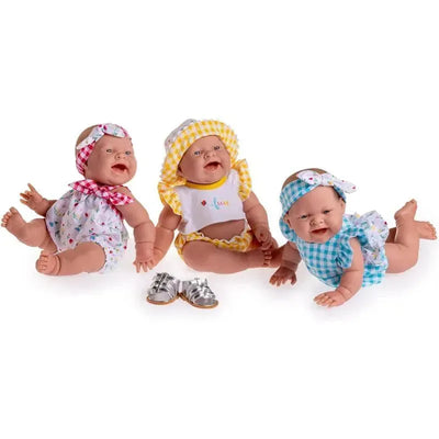 Three realistic 14” vinyl play dolls dressed in colorful outfits, displaying cheerful expressions, with one pair of silver shoes.
