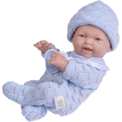 JC Toys Mini La Newborn 9.5-inch all-vinyl baby doll wearing a blue knit onesies and matching hat, holding a pacifier.