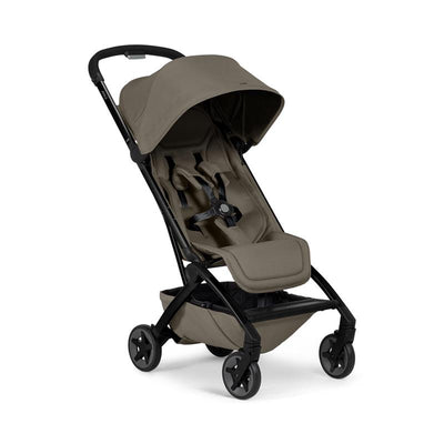 Lightweight compact stroller in Hazel Brown with a large canopy, safety harness, and a storage basket underneath.