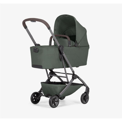 Joolz Aer2 Bassinet in Forest Green with a matching canopy and a modern folding stroller frame.