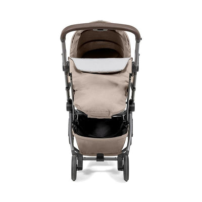 Joolz Aer2 Nest-to-Seat accessory in Sandy Taupe, designed for newborns to toddlers, showing a collapsible stroller frame with a soft seat area and storage basket.