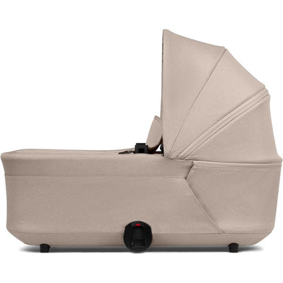 Joolz Hub2 Cot in Sandy Taupe, showcasing a sleek design with a raised canopy and a harness system.