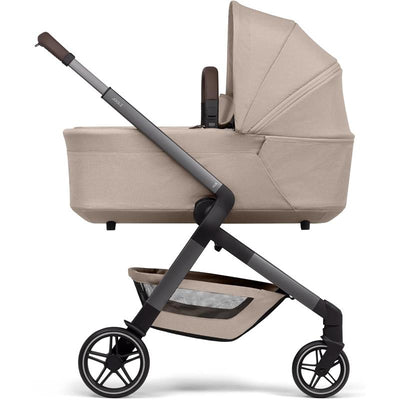 Joolz Hub2 Cot in Sandy Taupe with a smooth frame, large canopy, and under-seat storage basket.