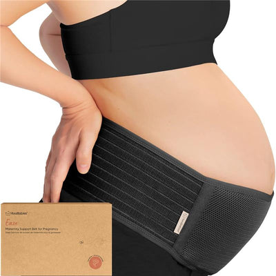 Maternity belly band by KeaBabies, worn by a pregnant woman, providing support to her belly, with packaging visible in the foreground.