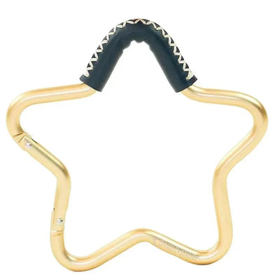Star-shaped gold and navy leather hook designed for strollers, featuring a padded grip.