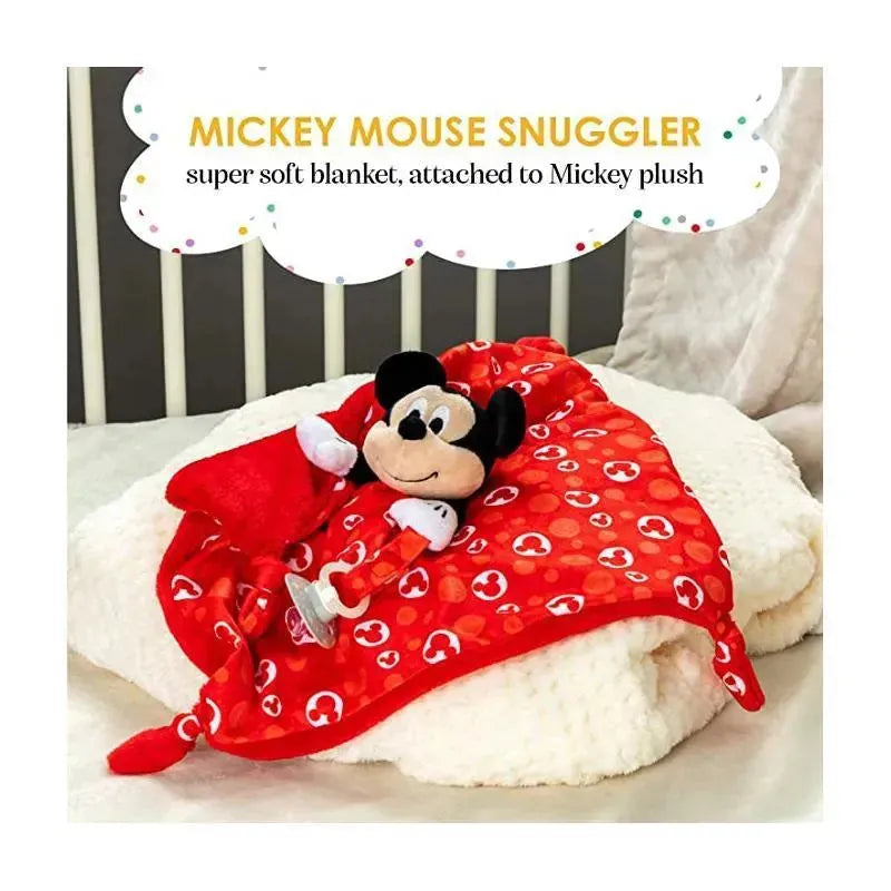 Mickey Mouse plush snuggler with red blanket featuring Mickey heads, resting on a soft white surface.