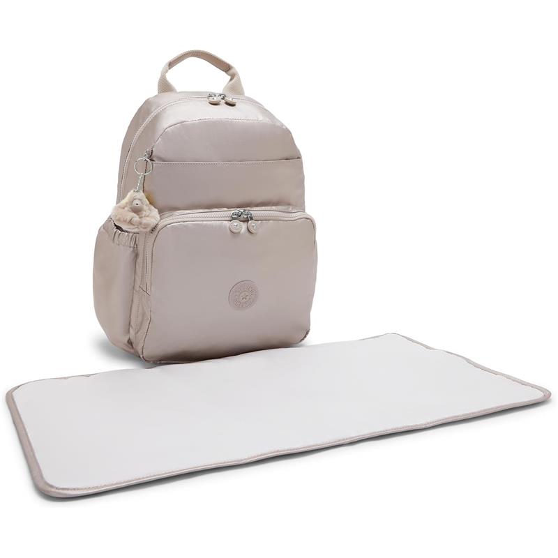 Kipling Maisie Diaper Backpack in Tiny Metallic Glow with a beige color, featuring a front pocket and included changing mat.