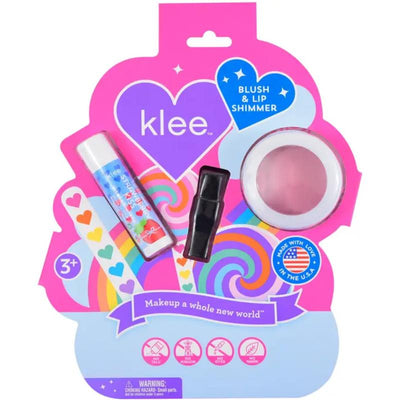 Blush and lip shimmer set from Klee Naturals, featuring a pink blush, lip shimmer, and lip gloss in colorful packaging.