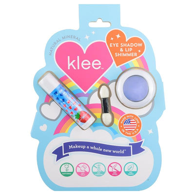 Klee Naturals LunaStar Eye Shadow and Lip Shimmer Kit featuring a periwinkle eyeshadow, lip shimmer, and applicator on a colorful backdrop.