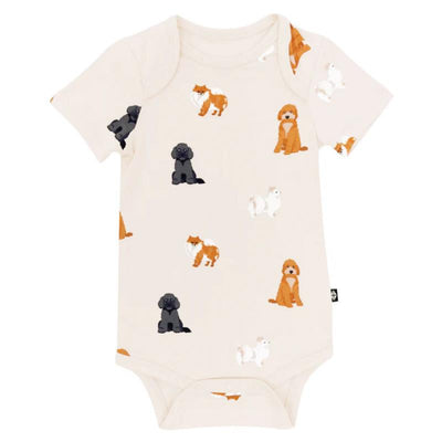Baby neutral bodysuit featuring a playful print of various fluffy dog illustrations in different colors.