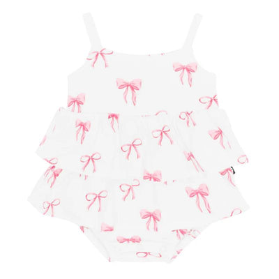 White ruffle romper with spaghetti straps, featuring a pink bow print, designed for infants.
