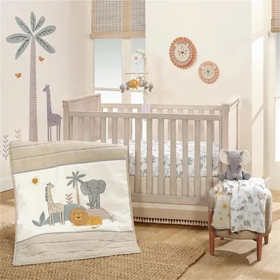 Lambs & Ivy 3-piece bedding set displayed in a nursery, featuring animal-themed blanket, a crib, and plush elephant toy.