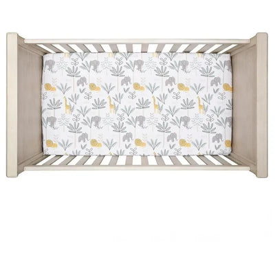 3-piece bedding set featuring a crib sheet with playful elephant and giraffe designs in gray and yellow.