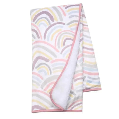 Baby blanket from Lambs & Ivy featuring a colorful rainbow pattern with a soft, white, fluffy interior.