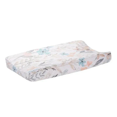 Soft changing pad cover featuring watercolor floral and butterfly design in pastel colors.