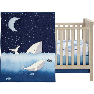 Lambs & Ivy Bubble & Squirt 3-Piece Crib Bedding Set featuring a whale-themed quilt and fitted sheet with fish patterns.