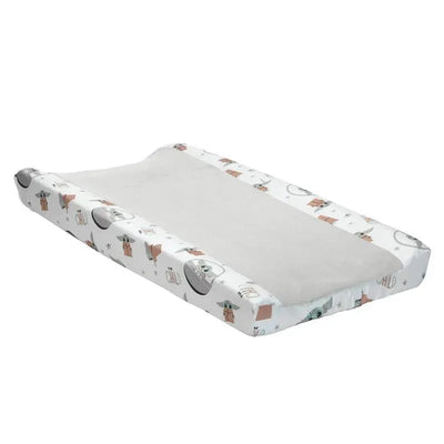 Changing pad cover featuring The Child (Baby Yoda) design with playful patterns and soft gray center.