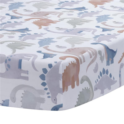 Fitted crib sheet featuring colorful, cartoonish dinosaurs on a white background, designed for baby or toddler bedding.