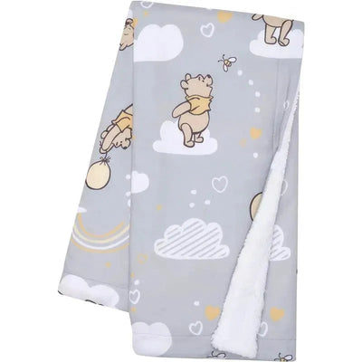 Gray Sherpa baby blanket featuring Winnie the Pooh illustrations among clouds and hearts, ideal for infant use.