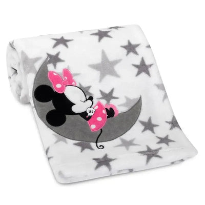Minnie Mouse blanket featuring a cuddly Minnie on a crescent moon, with a white background and grey stars.