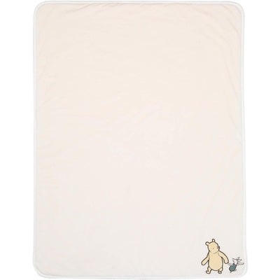 Lambs & Ivy Disney Storytime Pooh Baby Blanket featuring a soft beige color with Pooh and Piglet characters.