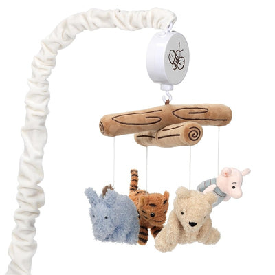 Disney Storytime Pooh Musical Mobile featuring plush characters: a bear, piglet, tiger, and blue animal, hanging from a wooden branch.