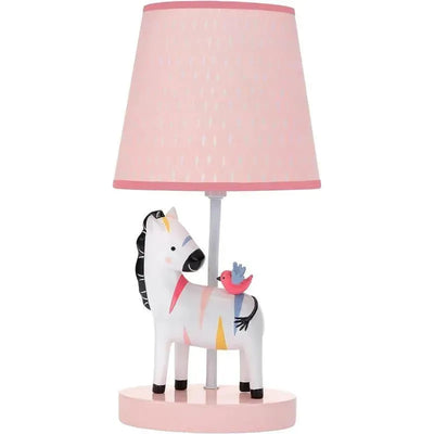 A nursery lamp featuring a zebra figure with colorful accents and a small bird perched on its back, topped with a pink shade.