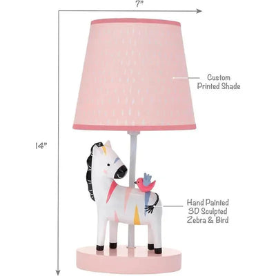 Lambs & Ivy Jazzy Jungle Zebra lamp features a hand-painted zebra with a bird, topped with a pink custom printed shade.