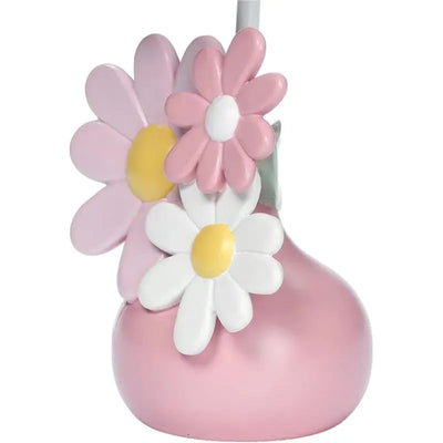 Lamp featuring a pink base adorned with colorful daisies in pink, white, and yellow, designed for a nursery.